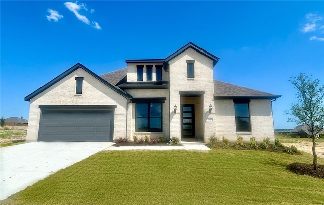 2613 Lee St, Burleson, TX 76028 - view of front facade featuring brick siding, concrete driveway, a front lawn, and a shingled roof
