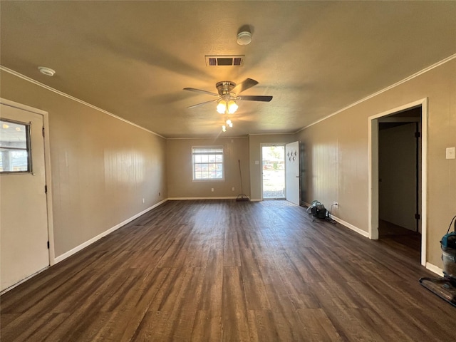 unfurnished living room featuring ornamental molding, ceiling fan, dark wood finished floors, and visible vents