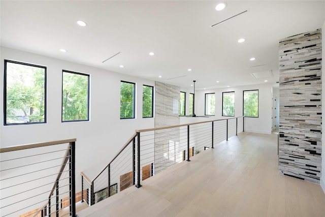 4218 Bonham St, Dallas, TX 75229 - corridor featuring recessed lighting, an upstairs landing, plenty of natural light, and light wood-style floors