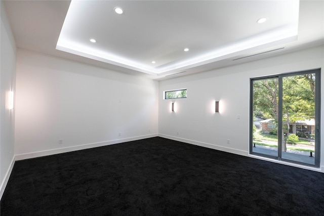 4218 Bonham St, Dallas, TX 75229 - unfurnished room with a tray ceiling, dark carpet, healthy amount of natural light, baseboards, and recessed lighting