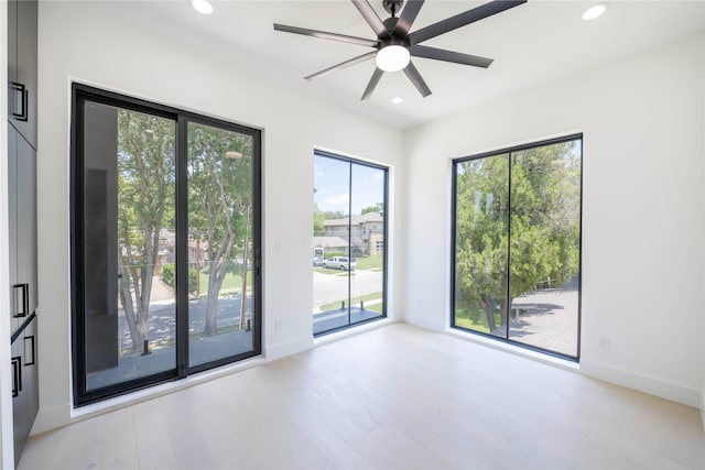 4218 Bonham St, Dallas, TX 75229 - spare room featuring plenty of natural light, wood finished floors, recessed lighting, a ceiling fan, and baseboards