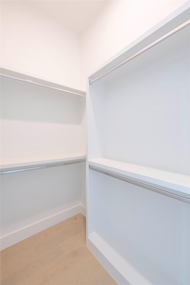 4218 Bonham St, Dallas, TX 75229 - spacious closet featuring light wood finished floors