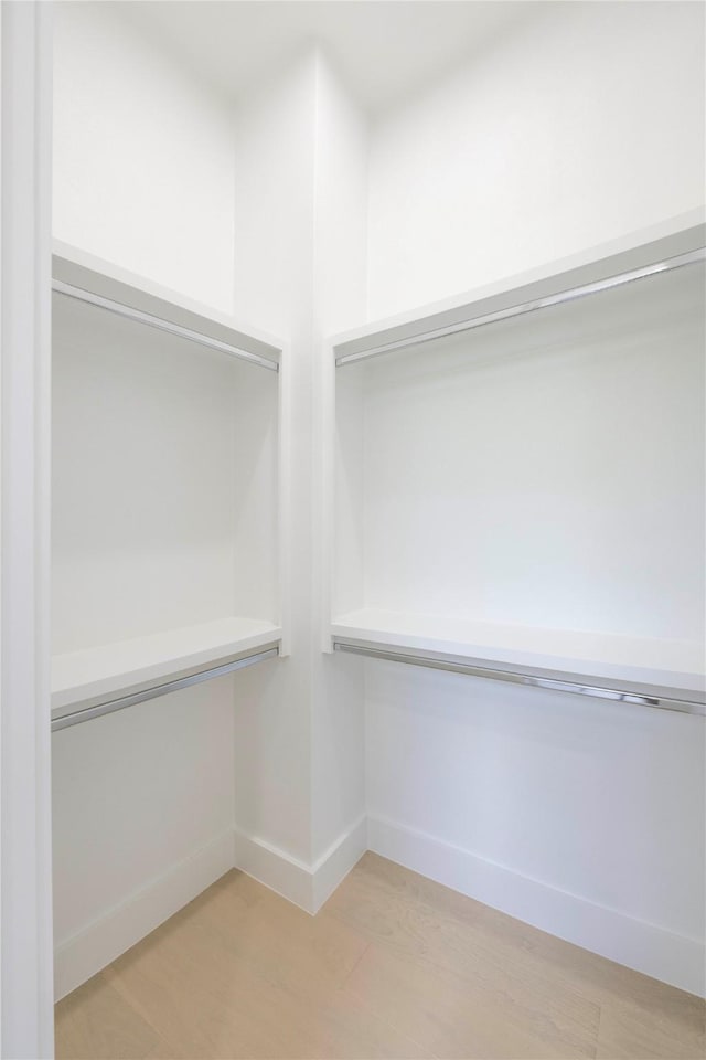 4218 Bonham St, Dallas, TX 75229 - walk in closet with light wood finished floors