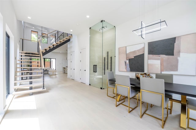 4218 Bonham St, Dallas, TX 75229 - interior space with stairs, wood finished floors, a towering ceiling, and recessed lighting