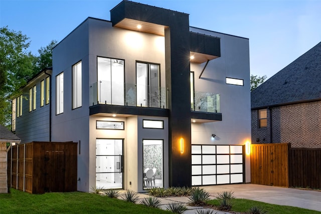 4218 Bonham St, Dallas, TX 75229 - modern home featuring fence, stucco siding, concrete driveway, and a garage