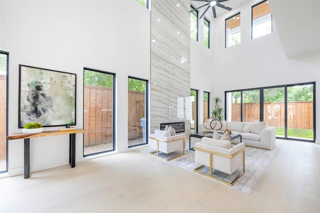 4218 Bonham St, Dallas, TX 75229 - living area with a towering ceiling, wood finished floors, and a ceiling fan