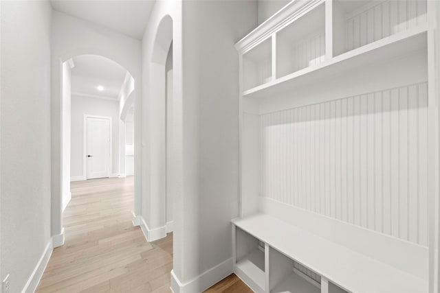 160 Waterview Dr, Gunter, TX 75058 - mudroom with arched walkways, baseboards, and light wood-style floors