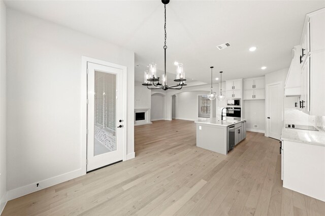 160 Waterview Dr, Gunter, TX 75058 - kitchen featuring open floor plan, light wood-type flooring, built in microwave, dishwasher, and a notable chandelier