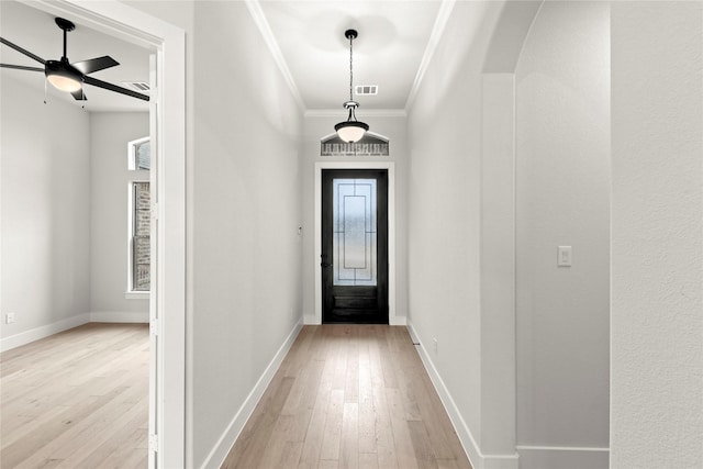 160 Waterview Dr, Gunter, TX 75058 - doorway to outside featuring crown molding, ceiling fan, plenty of natural light, light wood-style flooring, and visible vents
