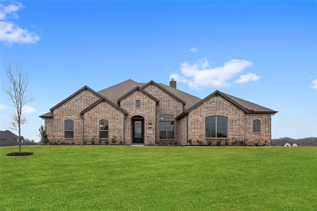 160 Waterview Dr, Gunter, TX 75058 - french provincial home featuring brick siding, a shingled roof, a chimney, and a front yard