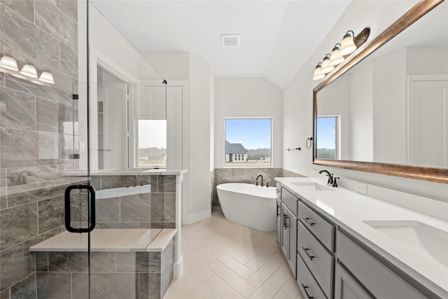 160 Waterview Dr, Gunter, TX 75058 - full bath featuring visible vents, a freestanding tub, lofted ceiling, a shower stall, and a sink