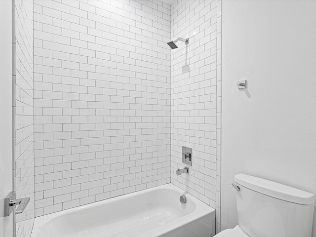 bathroom featuring toilet and shower / tub combination