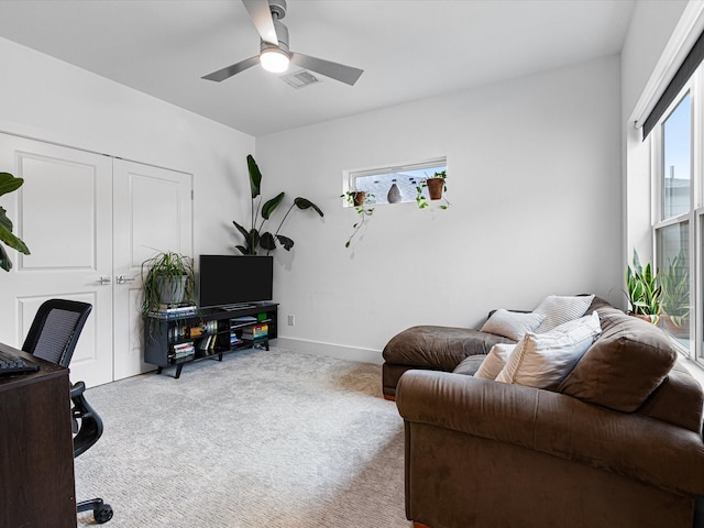 office featuring ceiling fan, baseboards, visible vents, and carpet floors
