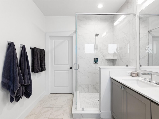 full bath featuring a shower stall, marble finish floor, vanity, and recessed lighting