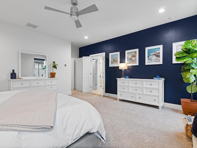 carpeted bedroom with recessed lighting, visible vents, baseboards, and a ceiling fan