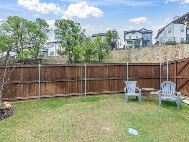 view of yard with fence and a residential view