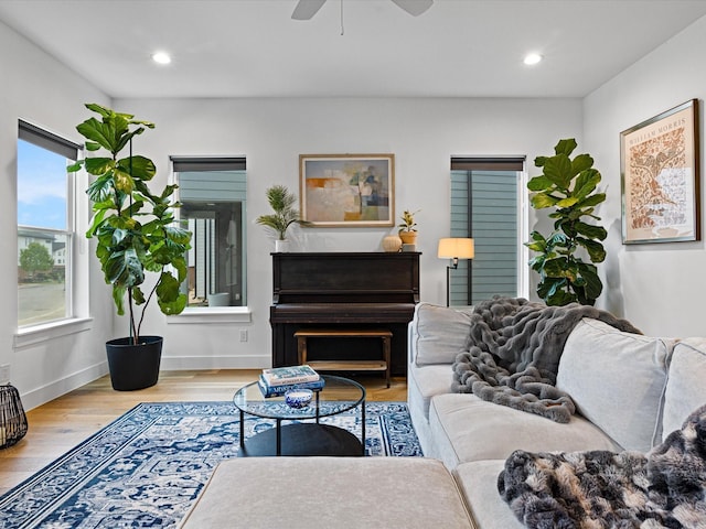 living area featuring recessed lighting, baseboards, a ceiling fan, and wood finished floors