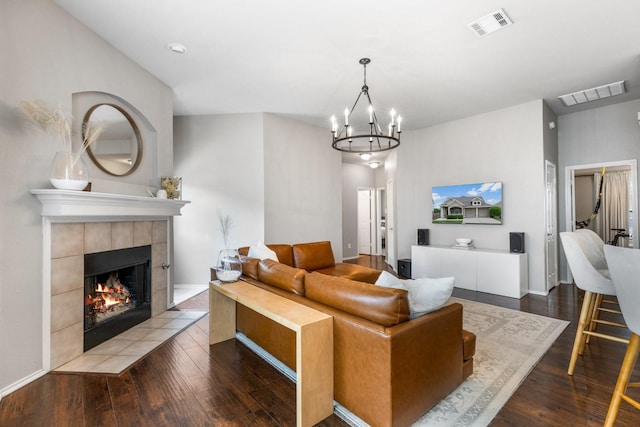 9836 Old Field Dr, Mckinney, TX 75072 - living room with visible vents, wood finished floors, and a fireplace