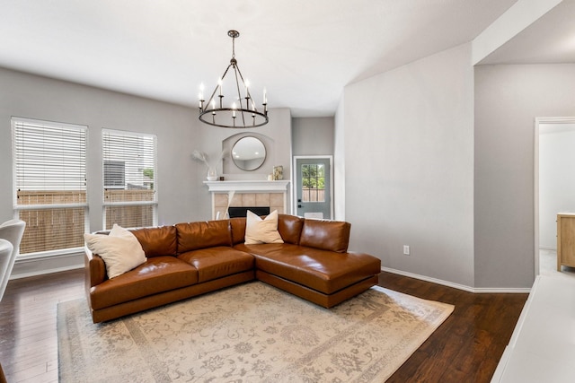 9836 Old Field Dr, Mckinney, TX 75072 - living area with an inviting chandelier, baseboards, wood finished floors, and a tile fireplace