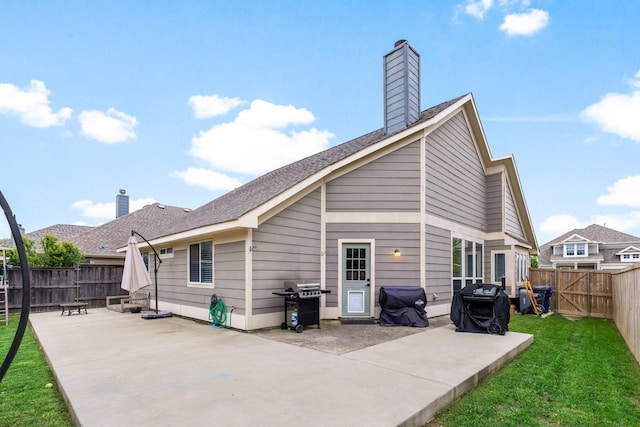 9836 Old Field Dr, Mckinney, TX 75072 - rear view of house featuring a fenced backyard, a chimney, a lawn, and a patio area
