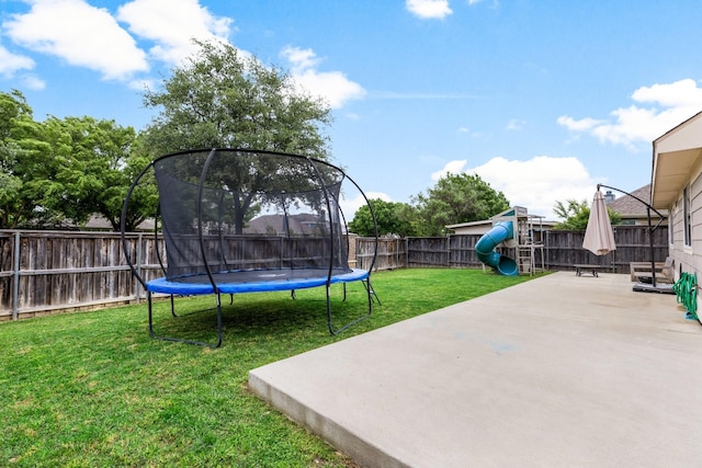 9836 Old Field Dr, Mckinney, TX 75072 - view of yard featuring a patio, a playground, a fenced backyard, and a trampoline