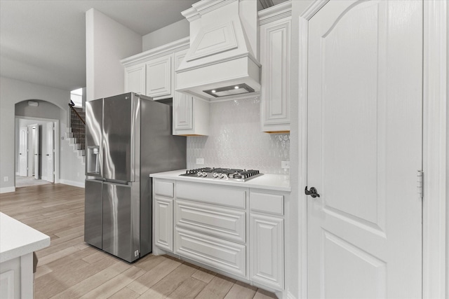 5010 Huffines Blvd, Royse City, TX 75189 - kitchen with light countertops, light wood finished floors, appliances with stainless steel finishes, and custom range hood
