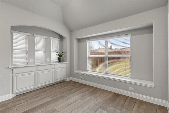 5010 Huffines Blvd, Royse City, TX 75189 - spare room with baseboards, vaulted ceiling, and light wood-style flooring