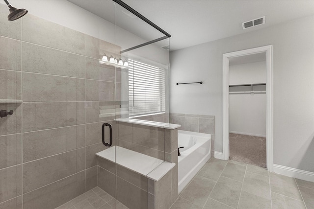 5010 Huffines Blvd, Royse City, TX 75189 - full bath with a garden tub, a stall shower, a spacious closet, tile patterned flooring, and visible vents