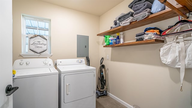 laundry room with laundry area, baseboards, electric panel, and separate washer and dryer