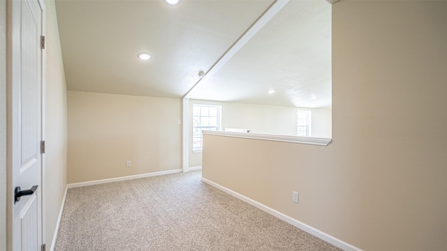 additional living space featuring baseboards, carpet, and recessed lighting