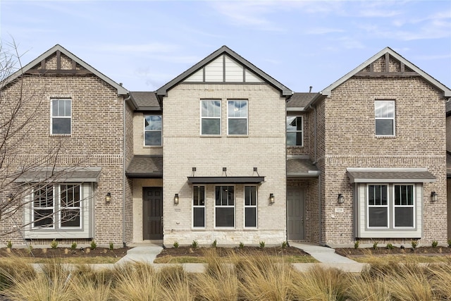 view of front of home with brick siding