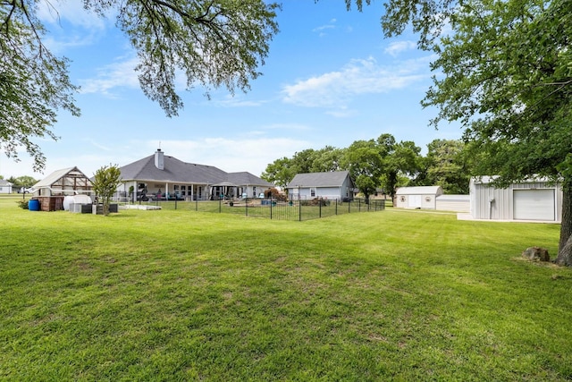 view of yard featuring fence and an outdoor structure