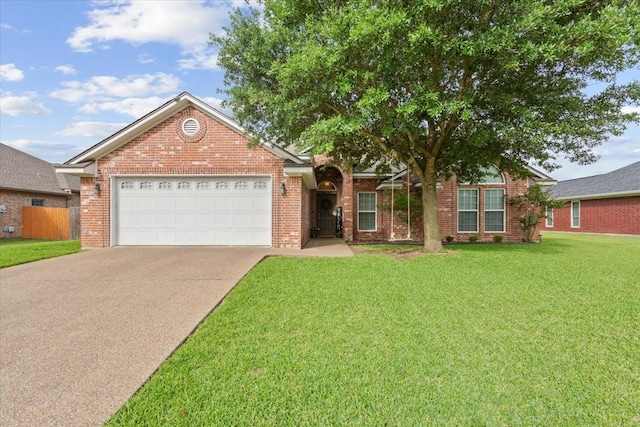 2905 Pueblo Dr, Waco, TX 76712 - single story home with a garage, concrete driveway, a front yard, and brick siding