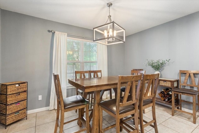 2905 Pueblo Dr, Waco, TX 76712 - dining area featuring light tile patterned flooring, a chandelier, and baseboards