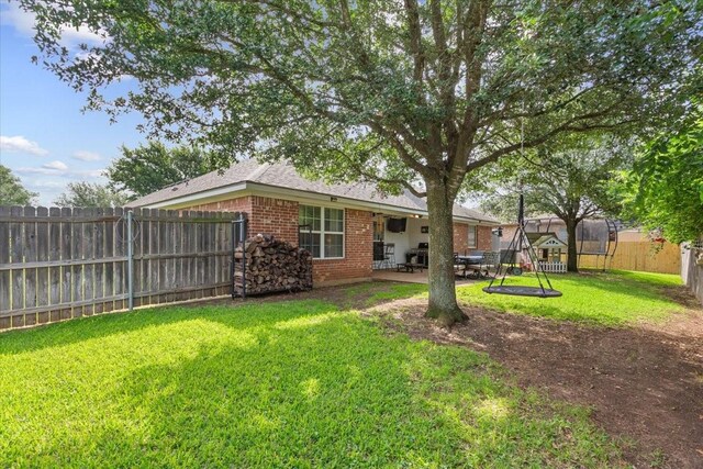 2905 Pueblo Dr, Waco, TX 76712 - view of yard with a trampoline and a patio