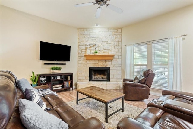 2905 Pueblo Dr, Waco, TX 76712 - living area with ceiling fan, wood finished floors, and a stone fireplace