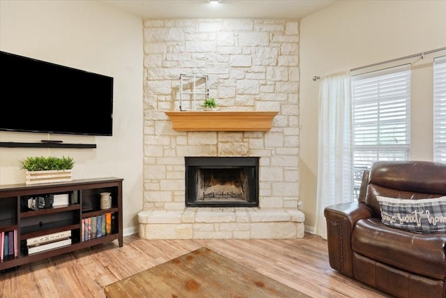 2905 Pueblo Dr, Waco, TX 76712 - living area with wood finished floors, a fireplace, and baseboards