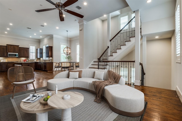 2110 Helsminster Dr, Dallas, TX 75201 - living room with a ceiling fan, healthy amount of natural light, dark wood-style flooring, recessed lighting, and crown molding