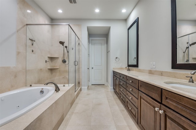 2110 Helsminster Dr, Dallas, TX 75201 - full bath featuring a jetted tub, a shower stall, double vanity, recessed lighting, and tile patterned flooring