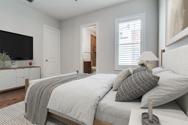 2110 Helsminster Dr, Dallas, TX 75201 - bedroom with wood finished floors and ensuite bath
