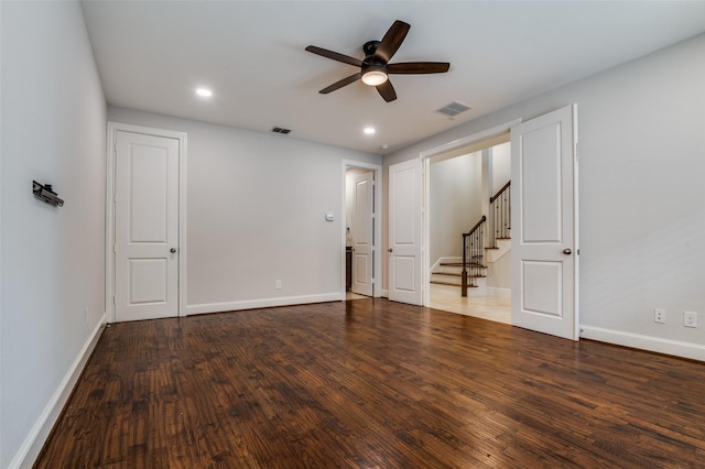 2110 Helsminster Dr, Dallas, TX 75201 - empty room featuring a ceiling fan, wood finished floors, stairway, baseboards, and recessed lighting