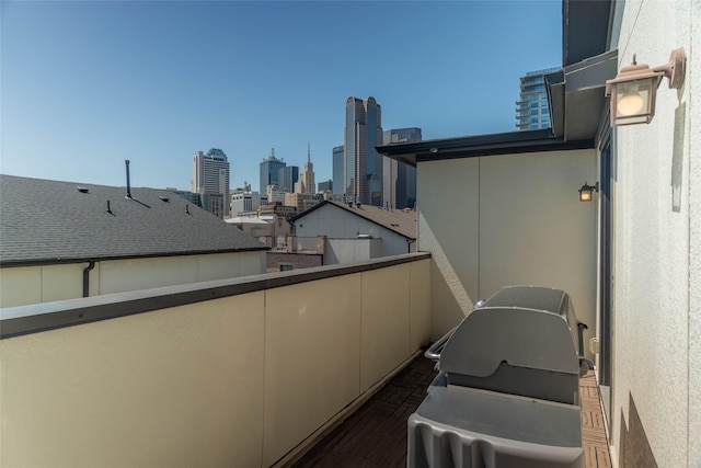 2110 Helsminster Dr, Dallas, TX 75201 - balcony featuring a view of skyline, area for grilling, and central air condition unit