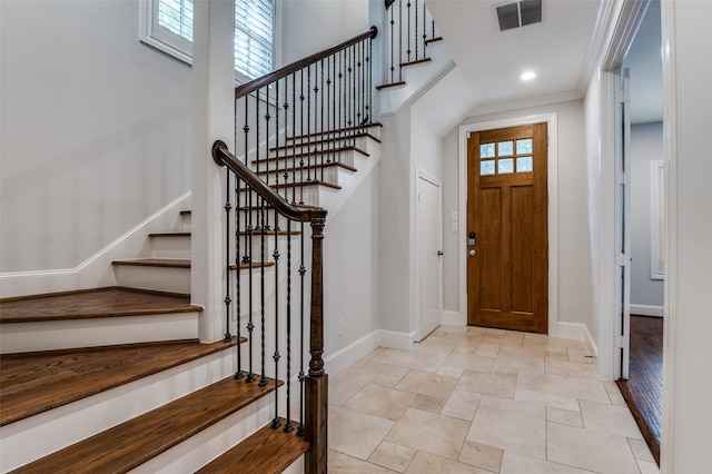 2110 Helsminster Dr, Dallas, TX 75201 - foyer entrance with baseboards, stone tile floors, stairway, ornamental molding, and recessed lighting