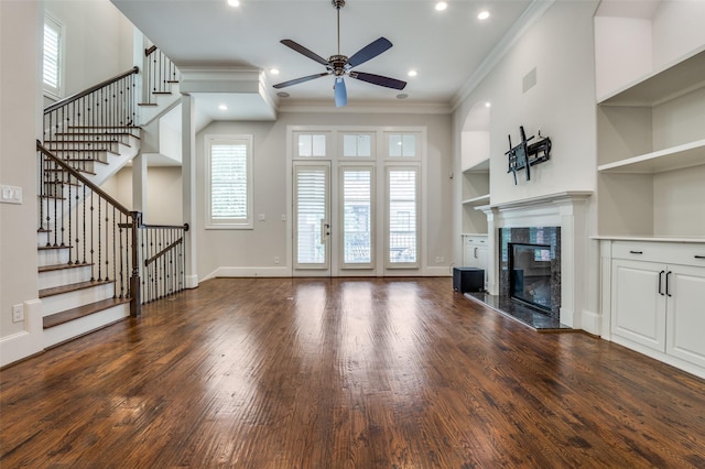 2110 Helsminster Dr, Dallas, TX 75201 - unfurnished living room featuring a ceiling fan, crown molding, wood finished floors, a fireplace, and stairway