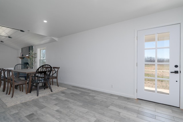 909 Crockett St, Santa Anna, TX 76878 - dining space featuring recessed lighting, light wood-style floors, baseboards, and lofted ceiling