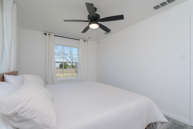 909 Crockett St, Santa Anna, TX 76878 - bedroom with ceiling fan, baseboards, and visible vents