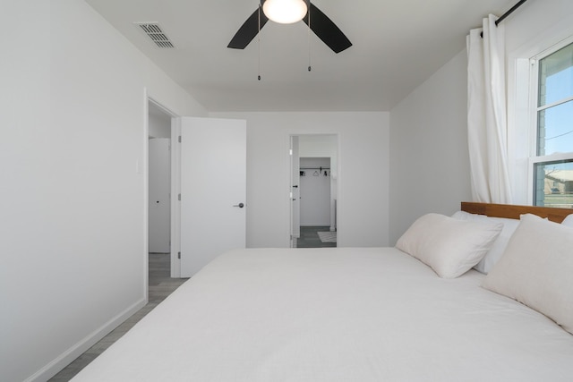 909 Crockett St, Santa Anna, TX 76878 - bedroom with visible vents, ceiling fan, and baseboards
