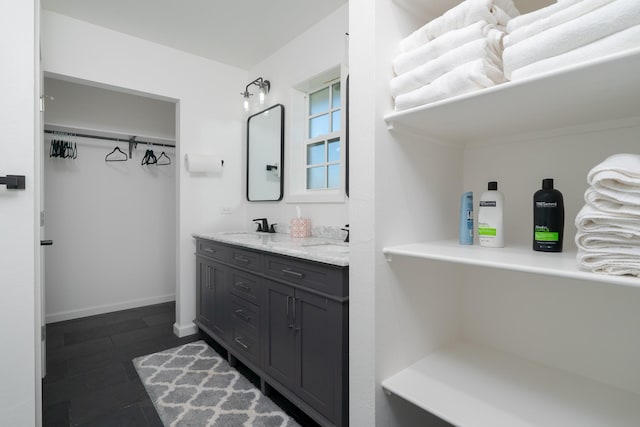 909 Crockett St, Santa Anna, TX 76878 - full bath featuring baseboards, a sink, and double vanity