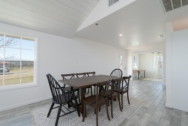 909 Crockett St, Santa Anna, TX 76878 - dining room with recessed lighting, visible vents, light wood-type flooring, and vaulted ceiling