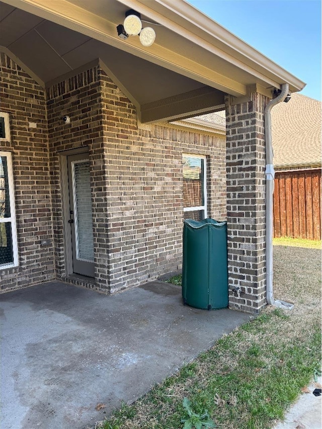 view of patio / terrace featuring fence